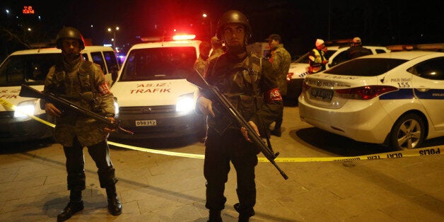 Turkish soldiers secure the site of an explosion after an attack targeted a convoy of military service vehicles in Ankara on February 17, 2016.At least 28 people were killed and 61 people were wounded in a car bombing targeting military service vehicles in the Turkish capital Ankara on February 17, Deputy Prime Minister Numan Kurtulmus told reporters. Kurtulmus condemned the attack and vowed to 'shed all light' on the bombing, but said there was no indication yet who may have carried it out. The toll substantially raised the previous toll of 18 dead. / AFP / ADEM ALTAN (Photo credit should read ADEM ALTAN/AFP/Getty Images)