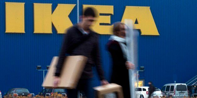 People walk in front of an IKEA shop in Berlin, Friday, Nov. 16, 2012. Swedish furniture giant Ikea expressed regret Friday that it benefited from the use of forced prison labor by some of its suppliers in communist East Germany more than two decades ago. (AP Photo/Markus Schreiber)