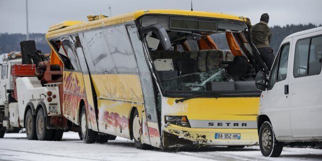 A damaged school bus is towed away in Pontarlier, after it crashed on a road in MontbenoÃ®t, eastern France, on February 10, 2016. Two teenagers were killed and four other persons slightly injured, after the school bus went off the road presumably due to bad weather conditions, according to the police. The accident occurred at around 7:30 a.m. on Wednesday, when it was on its way to the Lucie Aubrac college in the Doubs region. / AFP / FABRICE COFFRINI (Photo credit should read FABRICE COFFRINI/AFP/Getty Images)