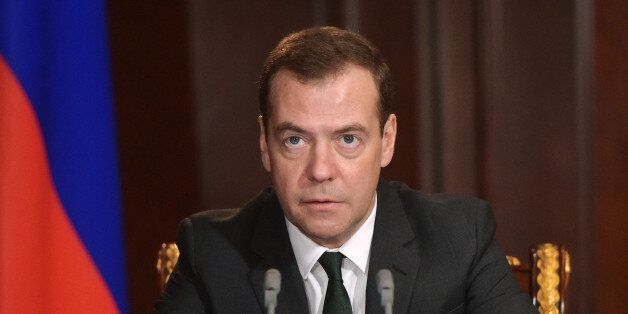 Russian Prime Minister Dmitry Medvedev holds a meeting on the situation in banking in the Gorki residence, outside Moscow, Russia, Monday, Feb. 8, 2016. The Central Bank pulled the license for Interkommerzbank, saying there was a significant imbalance between the assets and liabilities of the country's 67th largest bank. It also withdrew the license of the country's 186th largest bank, Alta Bank, on the grounds that it was unable to meet creditors' claims.(Alexander Astafyev/Sputnik, Government Press Service Pool Photo via AP)