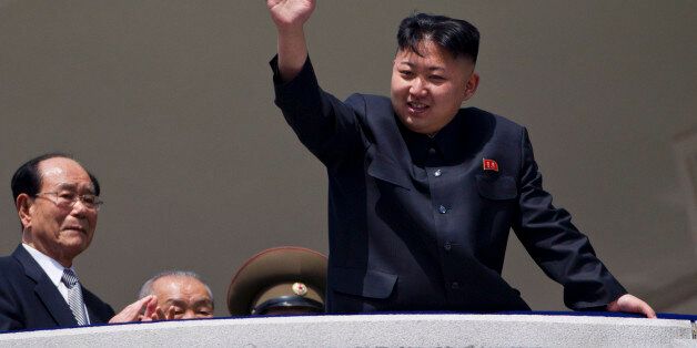 North Korean leader Kim Jong Un waves from a balcony at the end of a mass military parade in Pyongyang's Kim Il Sung Square to celebrate 100 years since the birth of his grandfather and North Korean founder Kim Il Sung on Sunday, April 15, 2012. North Korean leader Kim Jong Un delivered his first public televised speech Sunday, just two days after a failed rocket launch, portraying himself as a strong military chief unafraid of foreign powers during festivities meant to glorify his grandfather, North Korea founder Kim Il Sung. (AP Photo/David Guttenfelder)