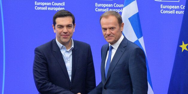 BRUSSELS, BELGIUM - FEBRUARY 4: Greek Prime Minister Alexis Tsipras (L) shakes hands with European Union President Donald Tusk (R) prior to their meeting at the European Union headquarters in Brussels on February 4, 2015. (Photo by Dursun Aydemir/Anadolu Agency/Getty Images)