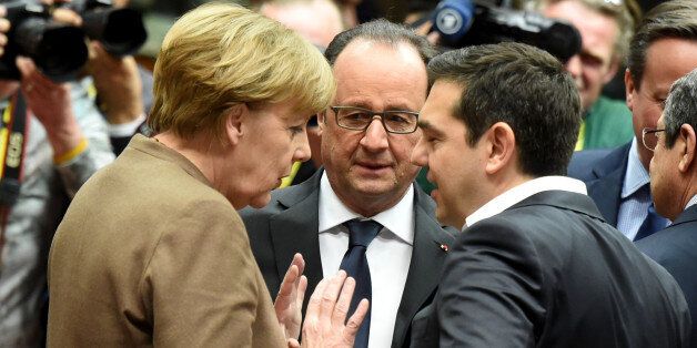 German Chancellor Angela Merkel, left,speaks with French President Francois Hollande, center, and Greek Prime Minister Alexis Tsipras, right, during a round table meeting at an EU summit in Brussels on Thursday, Feb. 18, 2016. European Union leaders are holding a summit in Brussels on Thursday and Friday to hammer out a deal designed to keep Britain in the 28-nation bloc. (AP Photo/Geert Vanden Wijngaert)