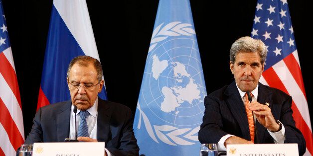U.S. Secretary of State John Kerry, right, and Russian Foreign Minister Sergey Lavrov arrive for a news conference after the International Syria Support Group (ISSG) meeting in Munich, Germany, Friday, Feb. 12, 2016. (AP Photo/Matthias Schrader)
