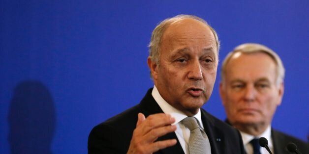 France's outgoing Foreign Minister Laurent Fabius (Front) delivers a speech as newly appointed French Foreign Minister Jean-Marc Ayrault listens during the handover ceremony on February 12, 2016 in Paris.French President Francois Hollande reshuffled his cabinet on February 11, 2016, naming Jean-Marc Ayrault foreign minister and adding several ecologists to government as he seeks to widen his political base ahead of a presidential poll in 2017. / AFP / PATRICK KOVARIK (Photo credit should read PATRICK KOVARIK/AFP/Getty Images)