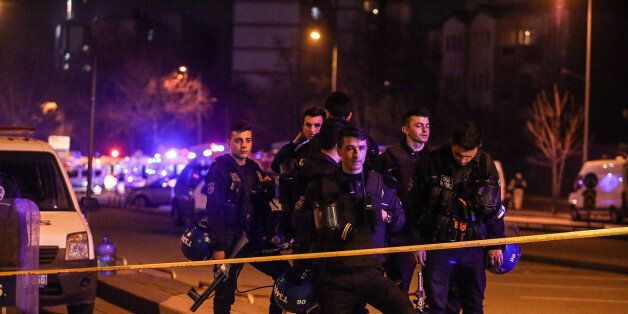 ANKARA, TURKEY - FEBRUARY 17: Turkish police secure the blast site after an explosion on February 17, 2016 in Ankara, Turkey. 21 people are believed to have been killed and at least 61 are said to be wounded according to the city's governor Mehmet Kiliclar in what appeared to have been a car bomb attack on a vehicle carrying military personnel in the Turkish capital. (Photo by Defne Karadeniz/Getty Images)