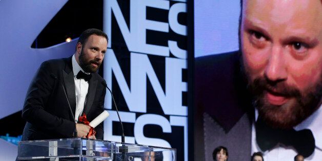 Director Yorgos Lanthimos speaks after he was presented the Jury Prize award for the film The Lobster during the awards ceremony at the 68th international film festival, Cannes, southern France, Sunday, May 24, 2015. (AP Photo/Lionel Cironneau)