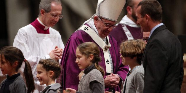 VATICAN CITY, VATICAN - FEBRUARY 10: Pope Francis greets children as he celebrates Ash Wednesday Mass at St. Peter's Basilica on February 10, 2016 in Vatican City, Vatican. Ash Wednesday opens the liturgical 40 day period of Lent; encouraging prayer, fasting, penitence and alms giving, leading up to Easter. The Pontiff will leave on Friday for Cuba and Mexico where he will hold an unprecedented meeting with Patriarch Kirill of Moscow and All Russia on February 12th. (Photo by Giulio Origlia/G