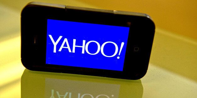 This September 12, 2013 photo illustration shows the newly designed Yahoo logo seen on a smartphone. Yahoo has refreshed its logo for the first time since the Internet companys founding 18 years ago. The new look unveiled September 4 is part of a makeover that Yahoo Inc. has been undergoing since the Sunnyvale, California company hired Google executive Marissa Mayer to become Yahoos CEO. AFP PHOTO / Karen BLEIER (Photo credit should read KAREN BLEIER/AFP/Getty Images)