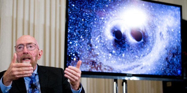 Laser Interferometer Gravitational-Wave Observatory (LIGO) Co-Founder Kip Thorne speaks next to a visual of gravitational waves from two converging black holes, right, during a news conference at the National Press Club in Washington, Thursday, Feb. 11, 2016, to announce that scientists they have finally detected gravitational waves, the ripples in the fabric of space-time that Einstein predicted a century ago. The announcement has electrified the world of astronomy, and some have likened the breakthrough to the moment Galileo took up a telescope to look at the planets. (AP Photo/Andrew Harnik)