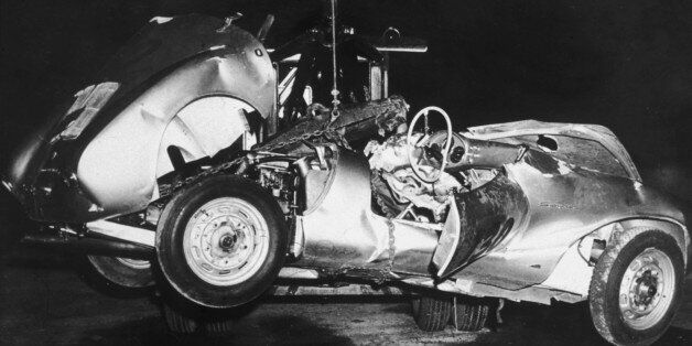 1955: The mangled remains of 'Little Bastard,' James Dean's Porsche Spyder sports car in which he died during a high-speed car crash, being towed by a tow truck, California. (Photo by Hulton Archive/Getty Images)