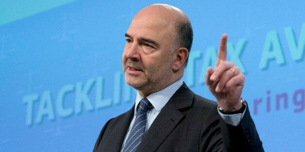 European Commissioner for Economic and Financial Affairs Pierre Moscovici speaks during a media conference at EU headquarters in Brussels on Thursday, Jan. 28, 2016. The European Union has unveiled new measures to combat tax evasion by big companies as part of efforts to end sweet deals between member countries and multinationals. (AP Photo/Virginia Mayo)