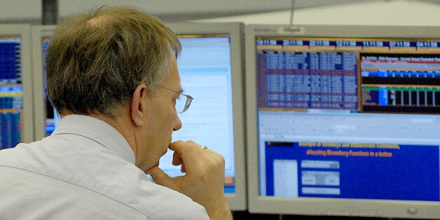 NETHERLANDS - MARCH 23: A trader works on the floor at the ABN Amro bank head office in Amsterdam, The Netherlands, Friday, March 23, 2007. For its 61 billion-euro ($83.5 billion) bid for the Netherlands' biggest bank, Barclays Plc has retained Citigroup Inc., Credit Suisse Group, Deutsche Bank AG, JPMorgan Cazenove Ltd. and Lazard Ltd. as counselors. (Photo by Paul O'Driscoll/Bloomberg via Getty Images)