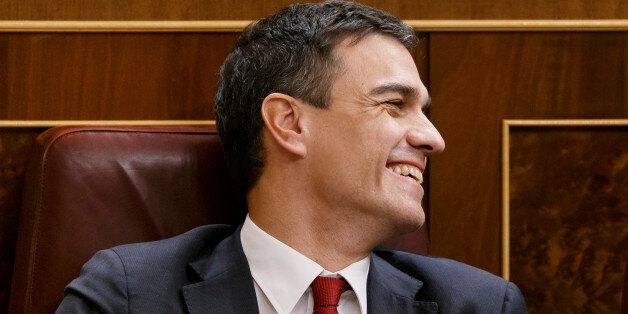 Spain's Socialist party leader Pedro Sanchez smiles at the Spanish Parliament in Madrid, Wednesday, Jan. 13, 2016 . Newly-elected lawmakers took their seats Wednesday in the first session of Spain's parliament following an inconclusive election Dec. 20 that has left the formation of the next government still undecided. It is the first time in nearly four decades of Spanish post-dictatorship democracy that parliament has been so fragmented, with at least four parties having a chance to take offic