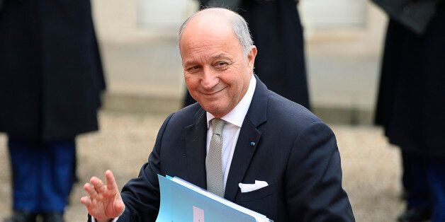 French Foreign Affairs minister Laurent Fabius waves as he arrives before a meeting with the Iranian president at the Elysee Palace in Paris on January 28, 2016. Rouhani begun an official visit to France on January 27 which is expected to include the signing of an agreement to buy more than 100 planes following talks with President Francois Hollande. AFP PHOTO / BERTRAND GUAY / AFP / BERTRAND GUAY (Photo credit should read BERTRAND GUAY/AFP/Getty Images)