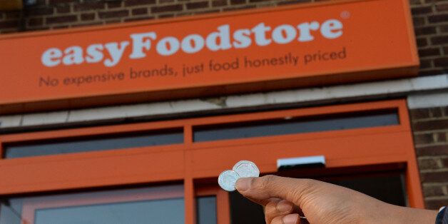 Shoppers buy items for 25p in a new easyFoodstore owned by easyJet founder Sir Stelios Haji-Ioannou in Park Royal, north-west London, in an attempt to cash in on the very cheapest end of the grocery market.