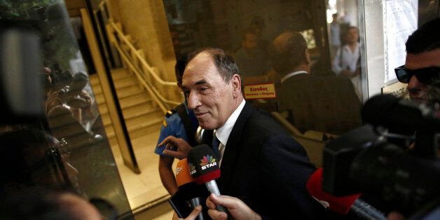 George Stathakis, Greece's economy minister, arrives at the finance ministry building in Athens, Greece, on Monday, July 6, 2015. European stocks dropped and the euro weakened as Greek voters' rejection of austerity sent investors to the relative safety of Treasuries, German bunds and the yen. Photographer: Kostas Tsironis/Bloomberg via Getty Images