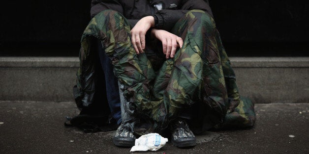 LONDON, ENGLAND - JANUARY 27: Wayne, 35 (no surname given) asks passers by for money near Westminster on January 27, 2016 in London, England. A group of 21 charities, including Crisis, St Mungos and Centrepoint, have called for extra effort by the next London Mayor to help end the growing problem of homelessness on Londons streets. (Photo by Dan Kitwood/Getty Images)