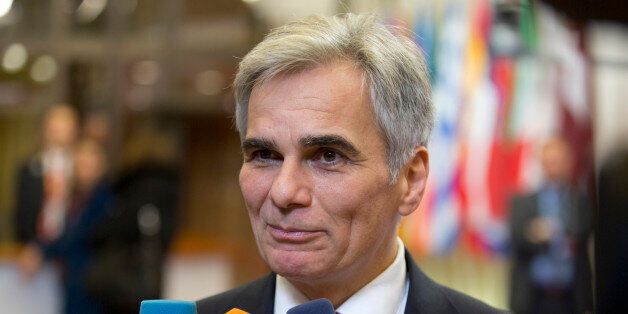 Austrian Chancellor Werner Faymann speaks with the media as he leaves after an EU summit in Brussels early Friday, Oct. 16, 2015. European Union heads of state met Thursday to discuss, among other issues, the current migration crisis. (AP Photo/Virginia Mayo)