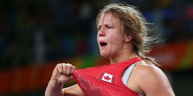 2016 Rio Olympics - Wrestling - Quarterfinal - Women's Freestyle 75 kg Quarterfinal - Carioca Arena 2 - Rio de Janeiro, Brazil - 18/08/2016. Erica Wiebe (CAN) of Canada celebrates her victory over Zhang Fengliu (CHN) of China. REUTERS/Toru Hanai FOR EDITORIAL USE ONLY. NOT FOR SALE FOR MARKETING OR ADVERTISING CAMPAIGNS.