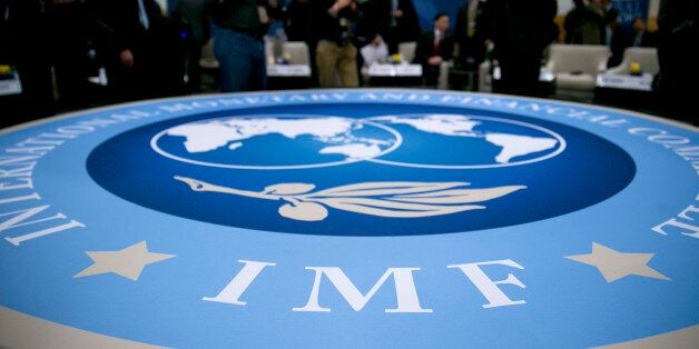 The International Monetary and Financial Committee (IMFC) logo is seen at an IFMC meeting during the International Monetary Fund (IMF) and World Bank Group Spring Meetings in Washington, D.C., U.S., on Saturday, April 20, 2013. The IMF's Managing Director said the euro area has the only central bank with enough leeway to take more measures to boost growth as low interest rates fail to trickle down to the region's economy. Photographer: Andrew Harrer/Bloomberg via Getty Images