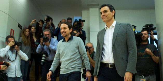 Spain's Socialist Party leader Pedro Sanchez, right, and Podemos Party leader Pablo Iglesias arrive for their meeting at the Spanish parliament in Madrid, Friday, Feb. 5, 2016. The meeting between Sanchez and Iglesias is a part of the negotiation rounds to try to form a government after elections. (AP Photo/Francisco Seco)
