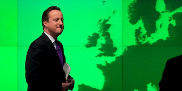 Britain's Prime Minister David Cameron walks past a map of Europe on a screen as he walks away after making a speech on holding a referendum on staying in the European Union in London, Wednesday, Jan. 23, 2013. Cameron said Wednesday he will offer British citizens a vote on whether to leave the European Union if his party wins the next election, a move which could trigger alarm among fellow member states. He acknowledged that public disillusionment with the EU is