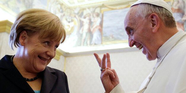 Pope Francis meets with German Chancellor Angela Merkel during a private audience at the Vatican, Saturday, May 18, 2013. (AP Photo/Gregorio Borgia, Pool)