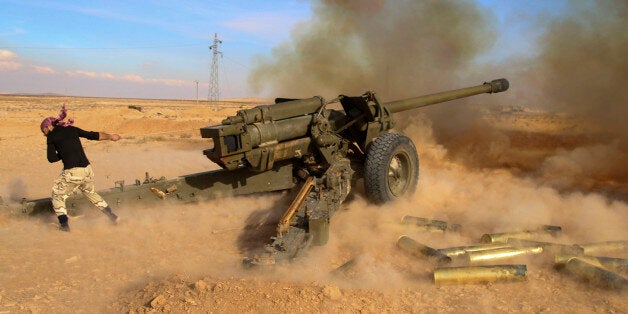 In this photo taken on Saturday, Jan. 30, 2016, Syrian government troops fire at Islamic State group positions near Mahin, Syria. The nearly five-year Syrian conflict has left at least 250,000 people dead, forced millions to flee the country and given an opening to the Islamic State group to capture territory in Syria and Iraq. It has drawn in U.S. and Russia, as well as regional powers such as Turkey, Saudi Arabia and Iran. (Alexander Kots/Komsomolskaya Pravda via AP)