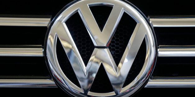 FILE - In this Feb. 14, 2013, file photo, a Volkswagen logo is seen on the grill of a Volkswagen on display in Pittsburgh. New Mexico is suing Volkswagen and other German automakers over an emissions cheating scandal that involves millions of cars worldwide, the first state to do so but almost certainly not the last. (AP Photo/Gene J. Puskar, File)