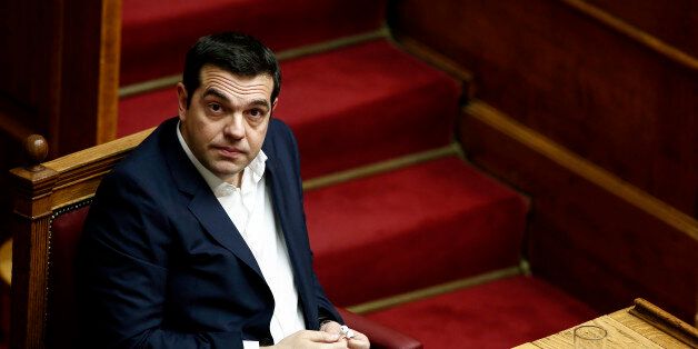 Greece's Prime Minister Alexis Tsipras attends a parliamentary session in Athens, Saturday, Dec. 5, 2015. Greek parliament votes on 2016 budget that sees the country slipping back into mild recession and maintaining high unemployment. (AP Photo/ Yorgos Karahalis)