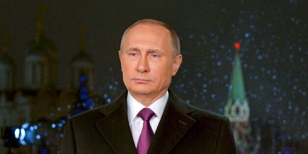 In this photo released by Kremlin Press service via Sputnik agency, Russian President Vladimir Putin speaks during a recording of his annual televised New Year's message in the Kremlin in Moscow, Russia, in Moscow, Russia, Thursday, Jan. 31, 2015. Putin is using his New Yearâs message to commemorate both the countryâs current fight in Syria and the battles of World War II seven decades ago. The recorded message was being televised just before midnight Thursday in each of Russiaâs nine time zones. (Pool Photo via AP)
