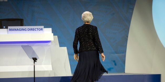 International Monetary Fund Chief Christine Lagarde returns to her seat after delivering a speech at the a plenary session of the World Bank and International Monetary Fund annual meetings, in Lima, Peru, Friday, Oct. 9, 2015. The world's top finance officials lavished praise on Peru's