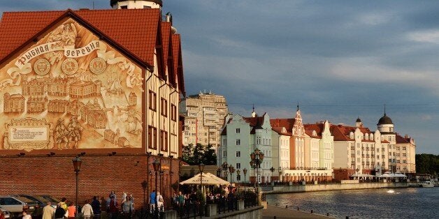 People walk along the promenade in the city of Kaliningrad, on July 18, 2015. Kaliningrad will host matches during the 2018 FIFA World Cup. AFP PHOTO / VASILY MAXIMOV (Photo credit should read VASILY MAXIMOV/AFP/Getty Images)