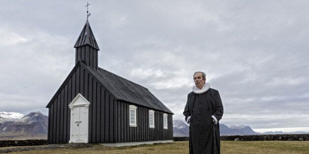 Priest in front of his church at Budir, Snaefellsnes, Iceland