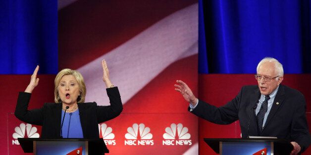 Hillary Clinton, former Secretary of State and 2016 Democratic presidential candidate, left, and Senator Bernie Sanders, an independent from Vermont and 2016 Democratic presidential candidate, react during the Democratic presidential candidate debate in Charleston, South Carolina, U.S., on Sunday, Jan. 17, 2016. Hours before Sunday's Democratic debate, the two top Democratic contenders held a warm-up bout of sorts in multiple separate appearances on political talk shows, at a time when the polling gap between the pair has narrowed in early-voting states. Photographer: Patrick T. Fallon/Bloomberg via Getty Images