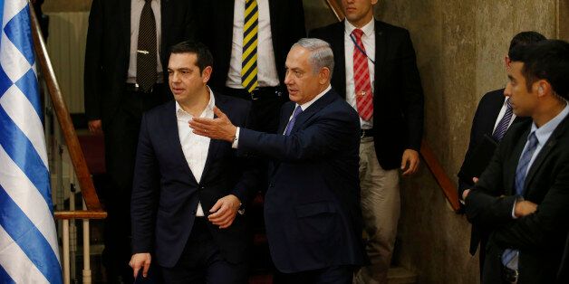 Israel's Prime Minister Benjamin Netanyahu and Greece's Prime Minister Alexis Tsipras, arrive for a press conference, in Jerusalem, Wednesday, Nov. 25, 2015. (Ronen Zvulun/Pool Photo via AP)