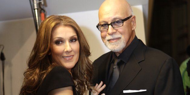 Celine Dion, left, talks with her husband Rene Angelil, right, before walking on the red carpet for the premiere of the film