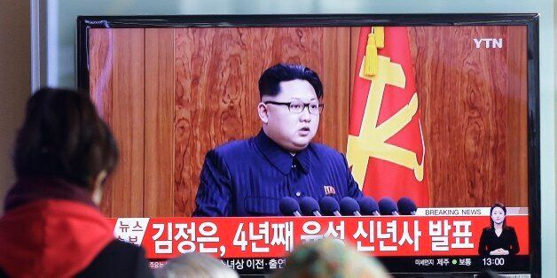 South Koreans watch a TV news program showing North Korean leader Kim Jong Un's New Year speech, at the Seoul Railway Station in Seoul, South Korea, Friday, Jan. 1, 2016. Kim said in an annual New Year speech that he's ready for war if provoked by