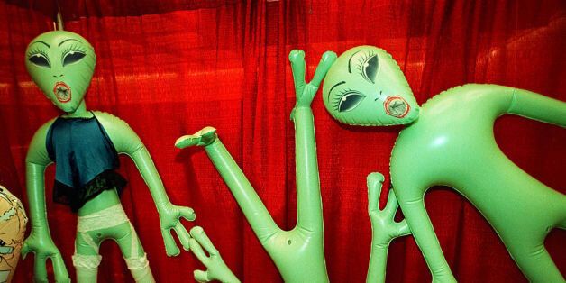 FEATURE: EROTICA LA: Inflatable sex doll toys shaped like extraterrestrial aliens hang on display at the Erotica L.A. convention, June 11, 1999 in Los Angeles. Erotica L.A. is an annual trade show, open to the public and designed to bring the 'adult industry' to 'mainstream America'. (Photo by David McNew)