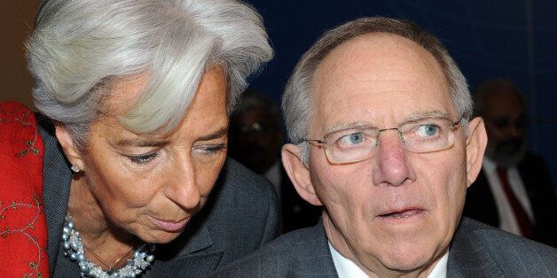 French Finance Minister Christine Lagarde, left, talks with German Finance Minister Wolfgang Schauble during the opening session of the G20 Finance summit in Paris, Saturday, Feb. 19, 2011. Finance chiefs from the world's 20 most industrialized and fastest developing nations discuss how to steady the world economy at a two-days meeting in Paris. (AP Photo/Miguel Medina, Pool)