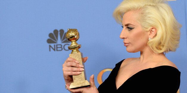 BEVERLY HILLS, CA - JANUARY 10: 73rd ANNUAL GOLDEN GLOBE AWARDS -- Pictured: Singer/actress Lady Gaga, winner of the award for Best Performance by an Actress in a Mini-Series or a Motion Picture Made for Television for 'American Horror Story', poses in the press room at the 73rd Annual Golden Globe Awards held at the Beverly Hilton Hotel on January 10, 2016. (Photo by Kevork Djansezian/NBC/NBCU Photo Bank via Getty Images)