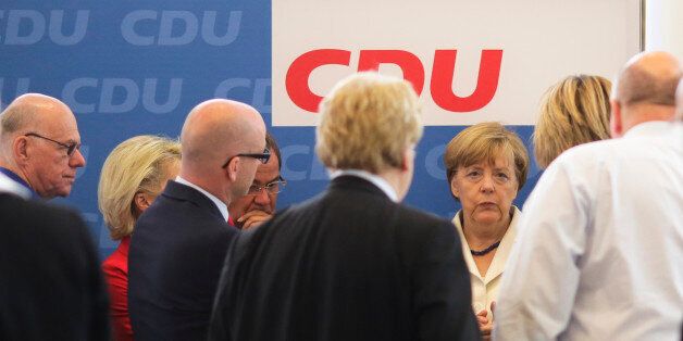 German Chancellor Angela Merkel, third right, attends a leaders meeting of her Christian Democratic Union party, CDU, at the party's headquarters in Berlin, Germany, Monday, July 13, 2015. A summit of eurozone leaders reached a tentative agreement with Greece on Monday for a bailout program that includes