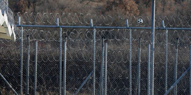 In this photo taken on Friday, Jan. 22, 2016, a child plays at a migrant transit camp outside the Greek town of Orestiada, near the Greek-Turkish border. Human rights groups are calling on the Greek government to grant asylum seekers safe passage at the border, so that fewer migrants and refugees chose the dangers sea route from Turkey to the Greek islands. (AP Photo/Thanassis Stavrakis)