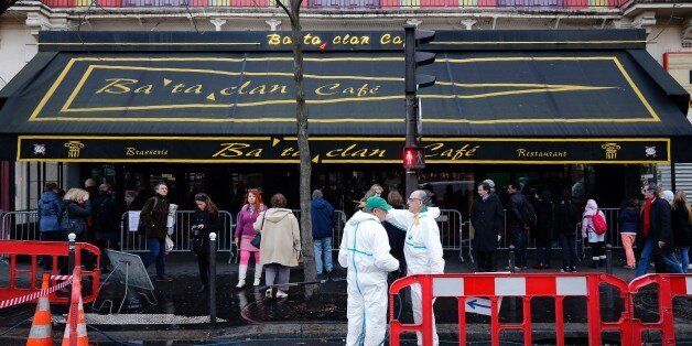 City workers clean the sidewalk and the street in front of the Bataclan concert hall in Paris on December 22, 2015, after the sidewalk in front of the venue was once again made accessable to pedestrians.A coordinated series of gun and bomb attacks at several sites in Paris on November 13, including the Bataclan concert hall, left 130 dead. / AFP / FRANCOIS GUILLOT (Photo credit should read FRANCOIS GUILLOT/AFP/Getty Images)