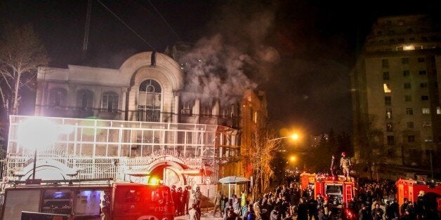 Iranian protesters set fire to the Saudi Embassy in Tehran during a demonstration against the execution of prominent Shiite Muslim cleric Nimr al-Nimr by Saudi authorities, on January 2, 2016. Nimr was a driving force of the protests that broke out in 2011 in Saudi Arabia's east, an oil-rich region where the Shiite minority of an estimated two million people complains of marginalisation. AFP PHOTO / ISNA / MOHAMMADREZA NADIMI / AFP / ISNA / MOHAMMADREZA NADIMI (Photo credit should read MOHAMMADREZA NADIMI/AFP/Getty Images)