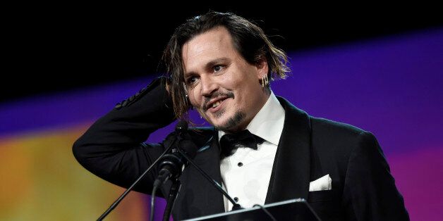 Johnny Depp accepts the Desert Palm achievement award - actor for âBlack Massâ at the 27th annual Palm Springs International Film Festival Awards Gala on Saturday, Jan. 2, 2016, in Palm Springs, Calif. (Photo by Chris Pizzello/Invision/AP)