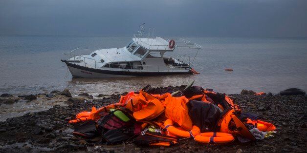 Life Jackets and a boat used by refugees and migrants to cross a part of the Aegean sea from Turkey to the Greek island of Lesbos remain on a beach, Thursday, Nov. 26, 2015. About 5,000 migrants reaching Europe each day over the so-called Balkan migrant route. The refugee crisis is stoking tensions among the countries on the so-called Balkan migrant corridor â Greece, Macedonia, Serbia, Croatia and Slovenia. (AP Photo/Santi Palacios)