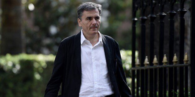 Greek Finance Minister Euclides Tsakalotos leaves the presidential palace after the swearing-in ceremony of the new government in Athens on September 23, 2015. Greek Prime Minister Alexis Tsipras took office with a core of returning ministers pledging to restart the country's flagging economy. AFP PHOTO / ARIS MESSINIS (Photo credit should read ARIS MESSINIS/AFP/Getty Images)
