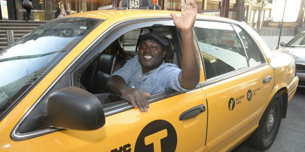 Taxi driver Frederick Amoafo, named the safest taxi driver in New York by the Taxi and Limousine Commission on Tuesday, August 26, 2014. Amoafo has taken more than 50,000 passengers over 190,000 miles over the past five years without a single accident. (Photo By: Jefferson Siegel/NY Daily News via Getty Images)